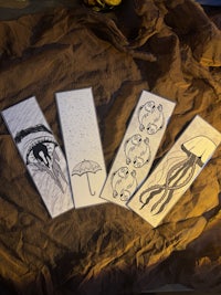 four pieces of paper with drawings on them